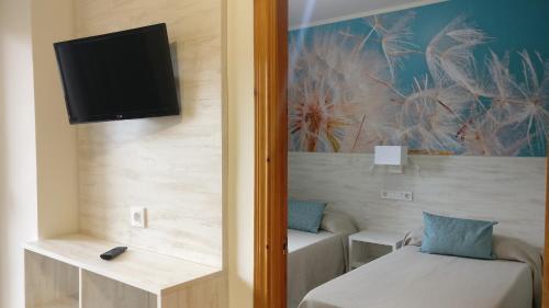 Foto de una habitación de Aparthotel Las Mariposas