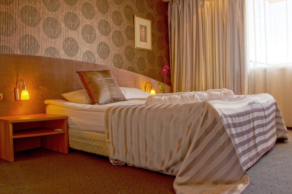 Foto de una habitación de Triada Hotel