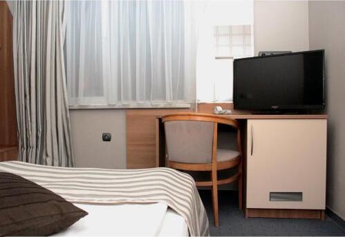 Foto de una habitación de Triada Hotel