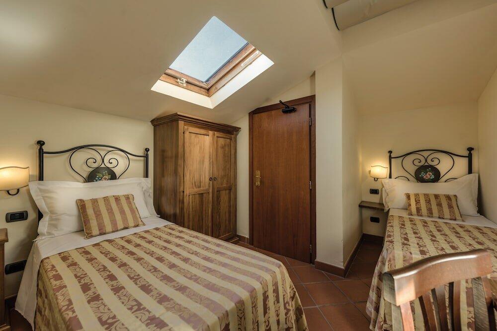 Foto de una habitación de Hotel &amp;amp; Restaurant Casolare Le Terre Rosse