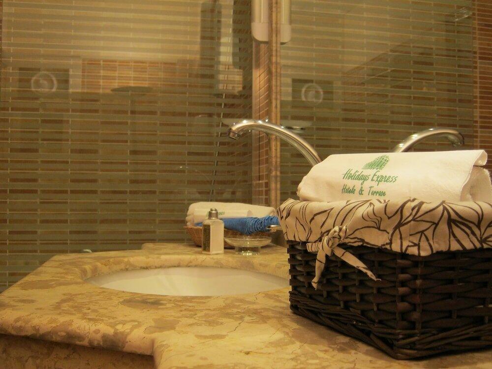 Foto de una habitación de Holidays Express Hotel