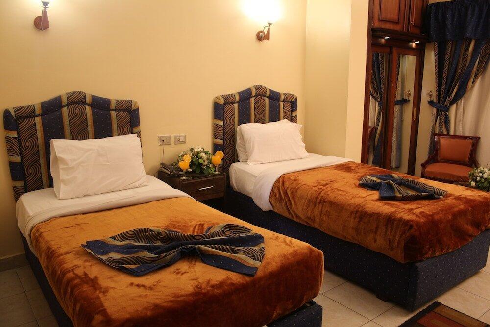 Foto de una habitación de Holidays Express Hotel