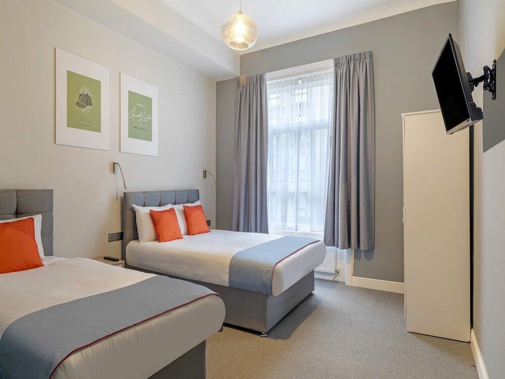 Foto de una habitación de Hotel OYO Townhouse Apollo