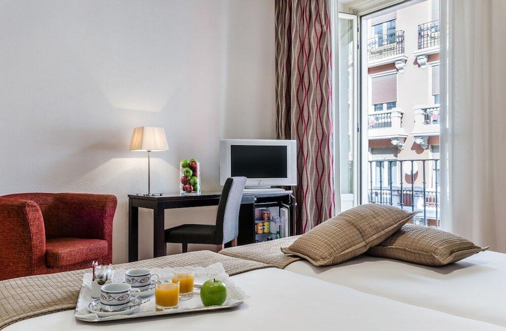 Foto de una habitación de Hotel Exe Suites 33