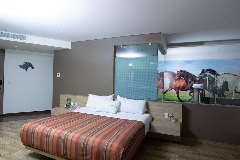 Foto de una habitación de Hotel Xcoco Inn
