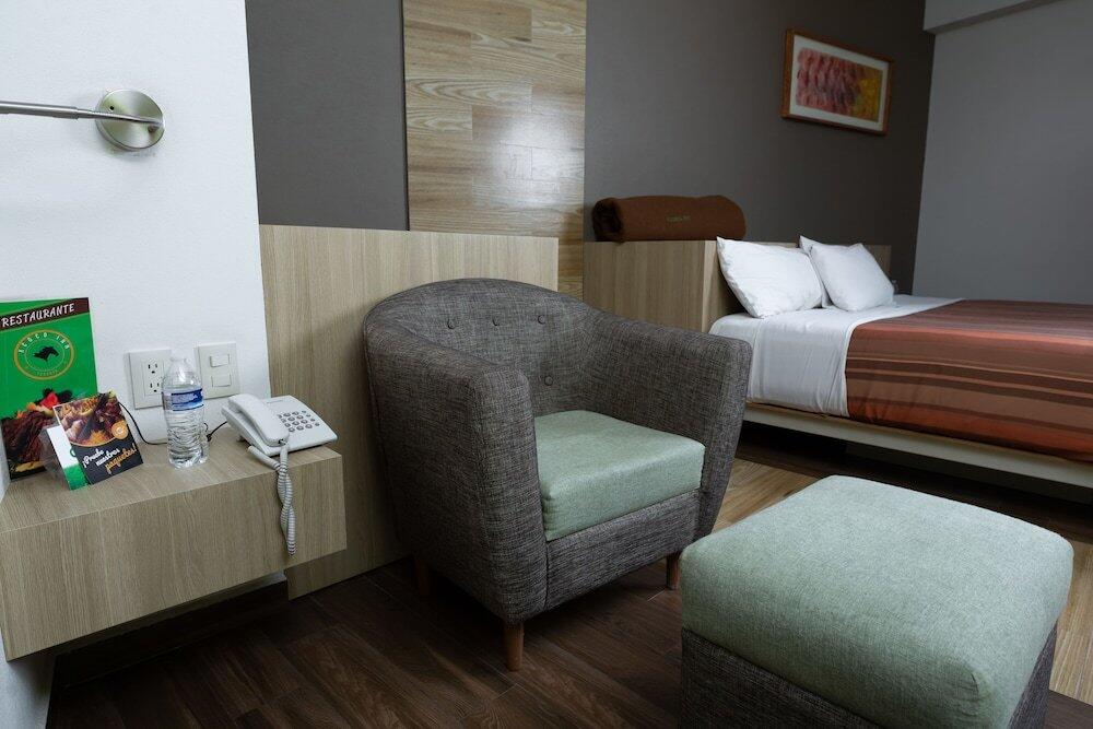 Foto de una habitación de Hotel Xcoco Inn