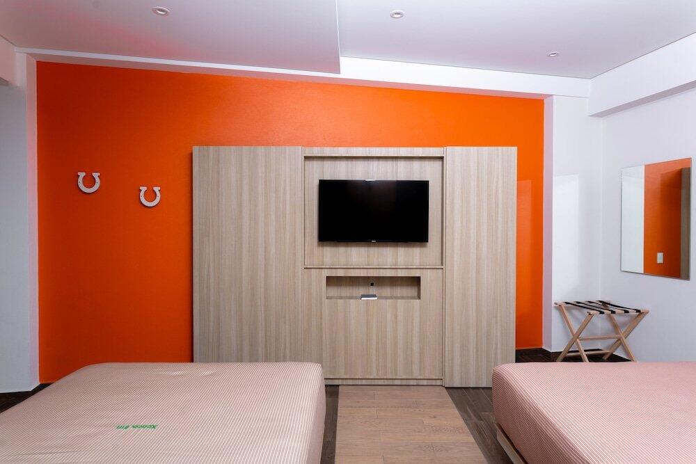 Foto de una habitación de Hotel Xcoco Inn