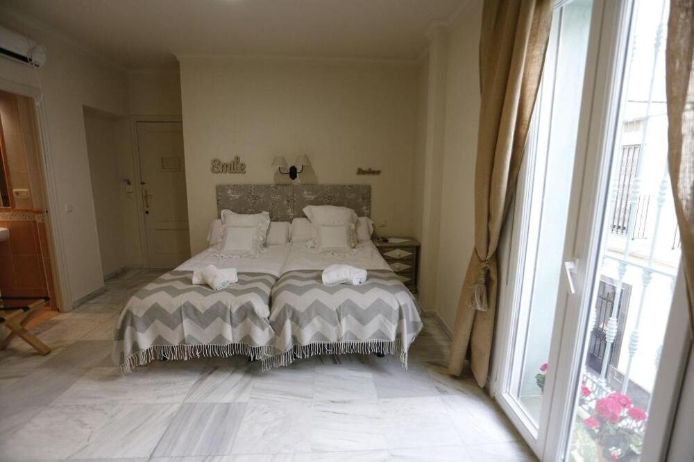 Foto de una habitación de Jardín de la Alameda Hostal Boutique