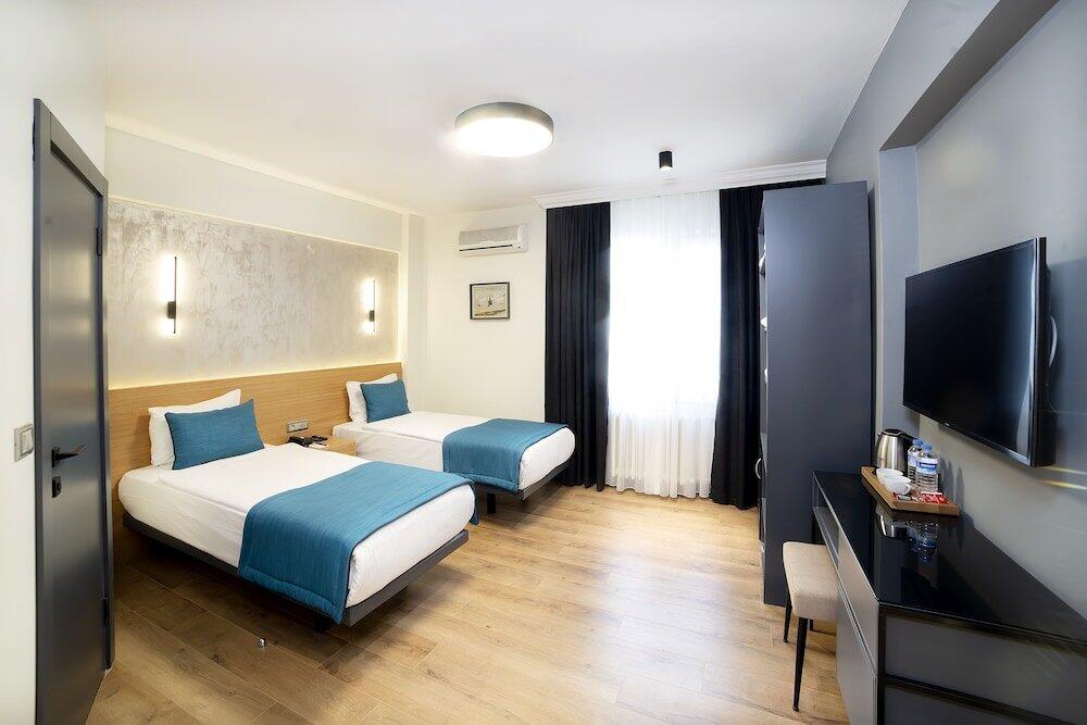 Foto de una habitación de Barin Hotel