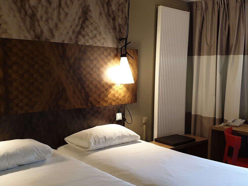 Foto de una habitación de Hotel ibis Europe Chalon Sur Saone