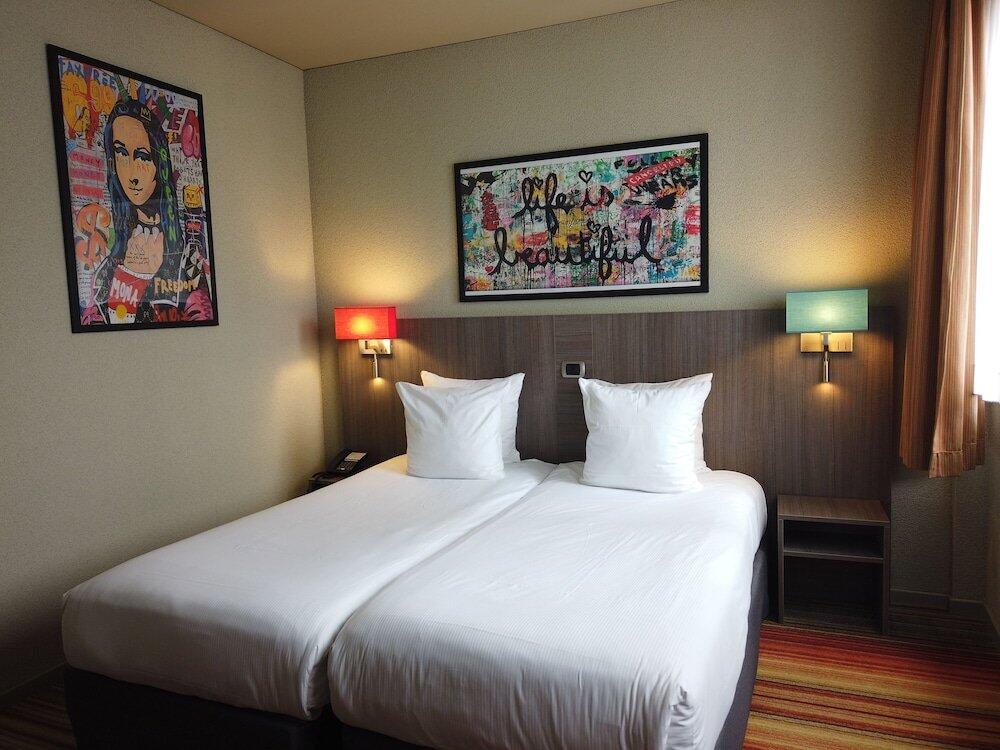 Foto de una habitación de Alma Grand Place Hotel