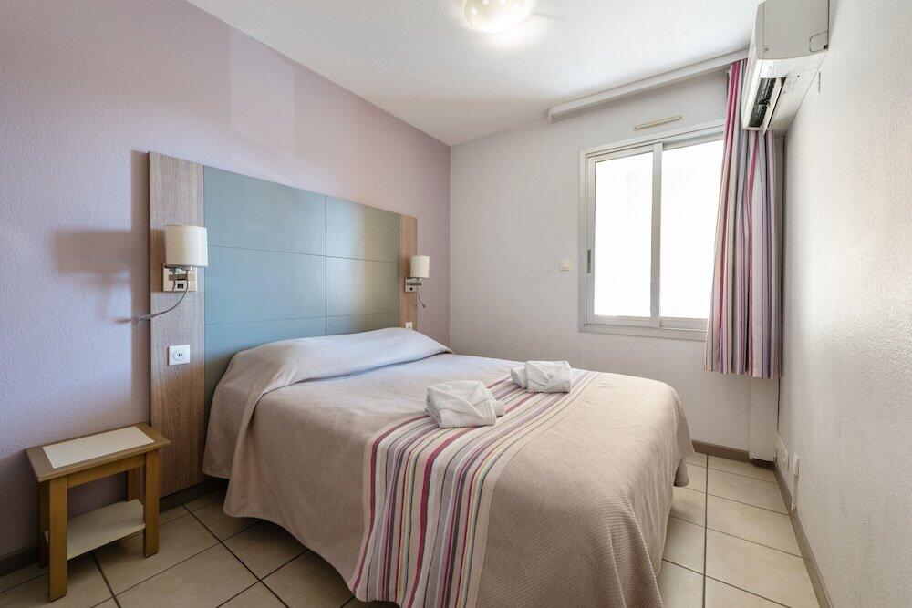 Foto de una habitación de Pierre &amp;amp; Vacances Résidence La Rostagne