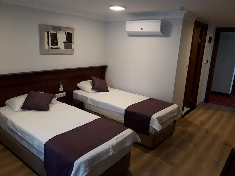 Foto de una habitación de Alkan Hotel