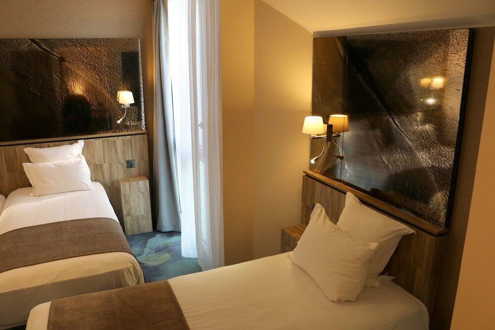 Foto de una habitación de Hotel Le Saint Aubert