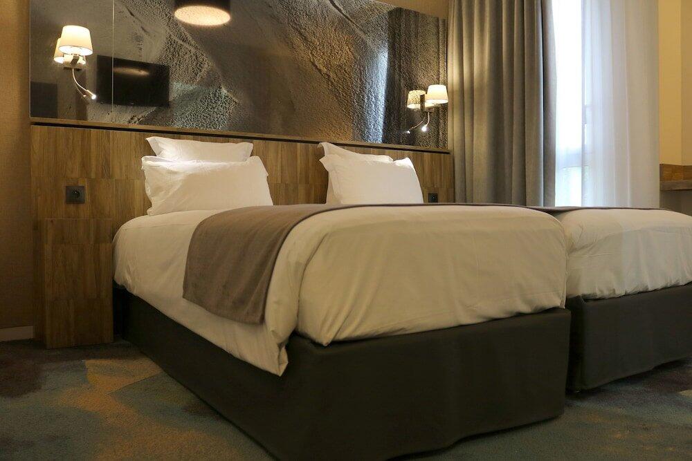 Foto de una habitación de Hotel Le Saint Aubert
