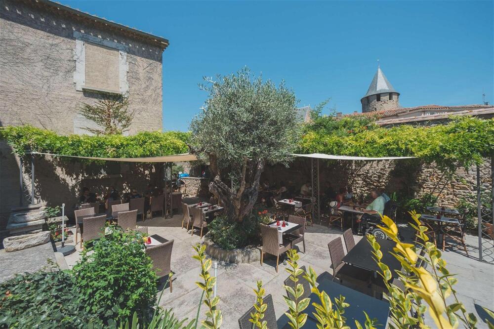 Foto de restauración de Hôtel Le Donjon - Cœur de La Cité Médiévale