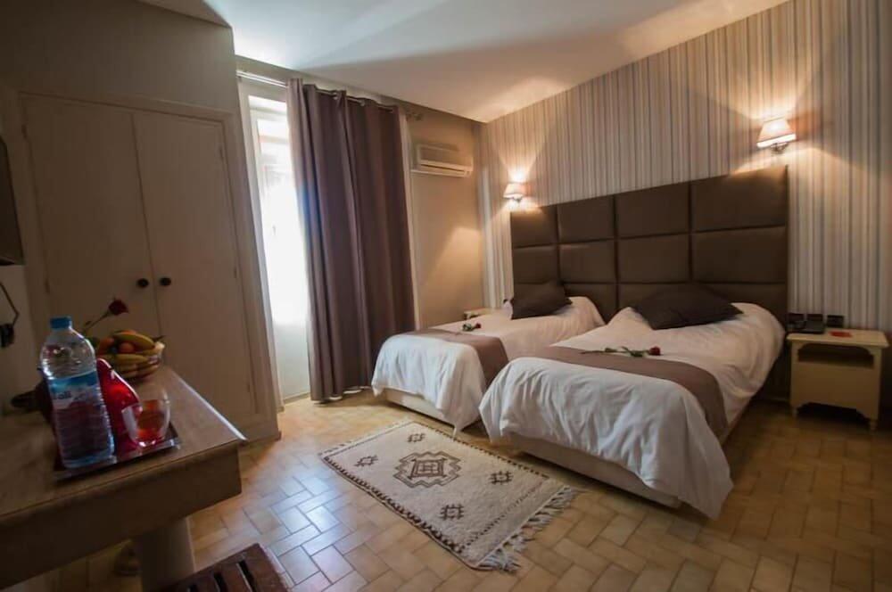 Foto de una habitación de Hotel De La Paix