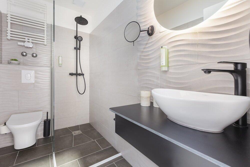 Foto del baño de Novum Hotel Lichtburg am Kurfürstendamm