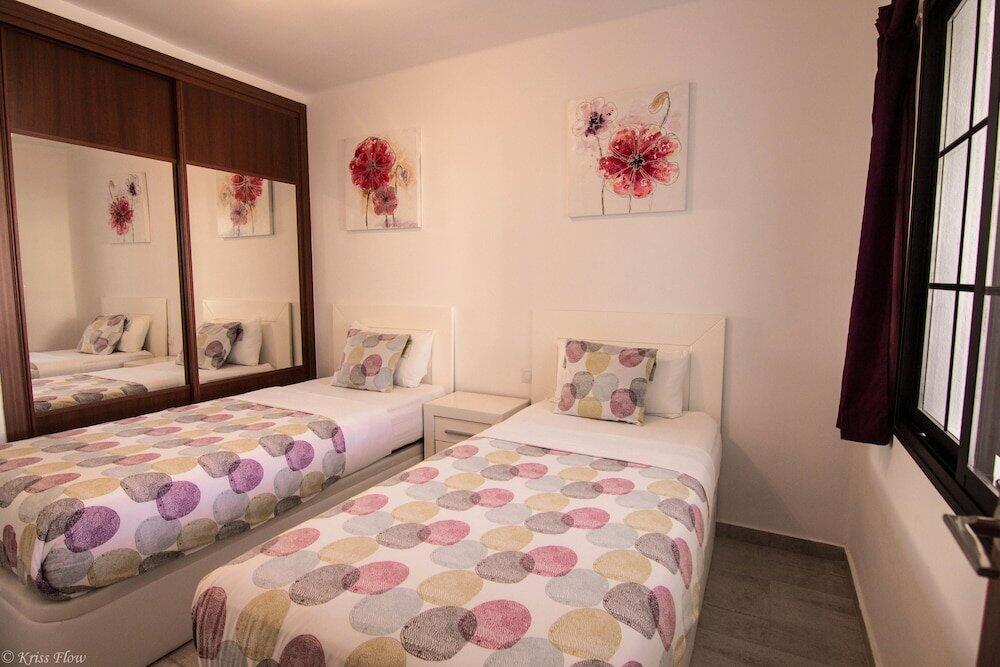 Foto de una habitación de Apartamentos Club Atlántico