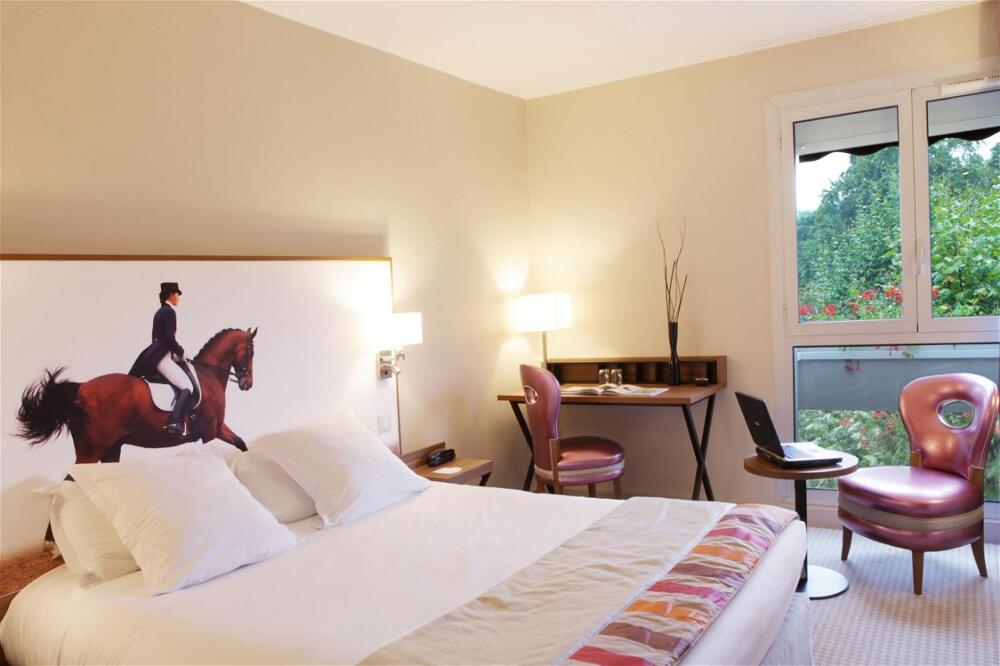 Foto de una habitación de Best Western Plus Hotel Du Parc Chantilly