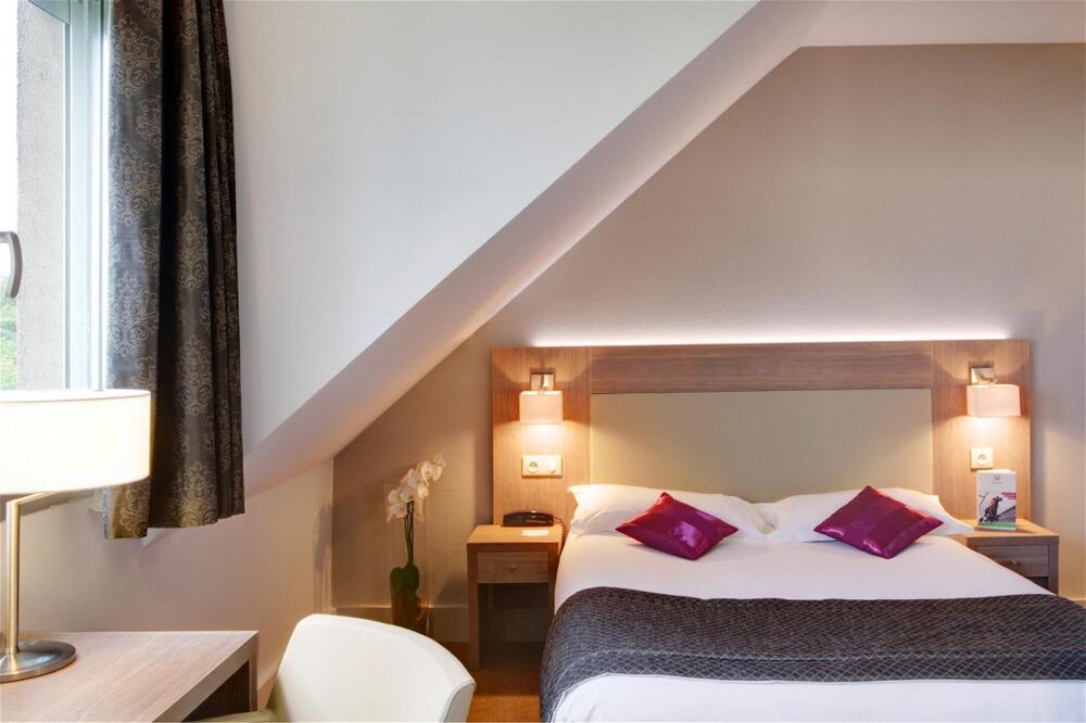 Foto de una habitación de Best Western Plus Hotel Du Parc Chantilly