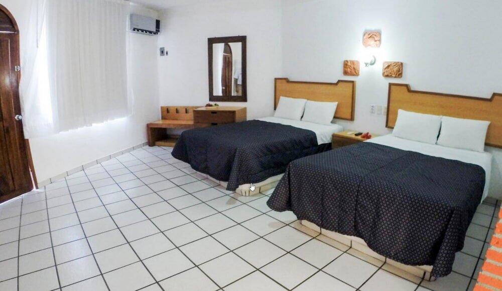 Foto de una habitación de Costa Alegre Hotel &amp;amp; Suites