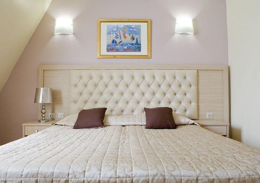Foto de una habitación de Hôtel Lebron