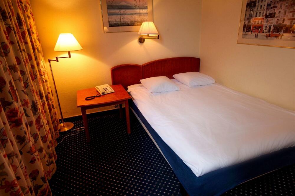 Foto de una habitación de First Hotel Statt