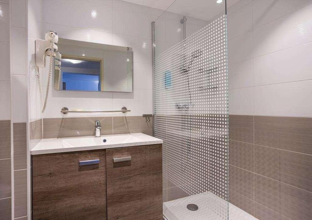 Foto del baño de Aparthotel Les Loges du Park