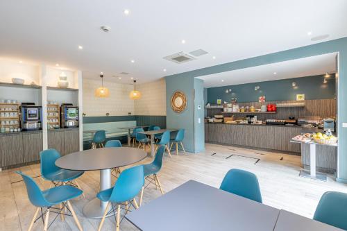 Foto de restauración de Aparthotel Les Loges du Park