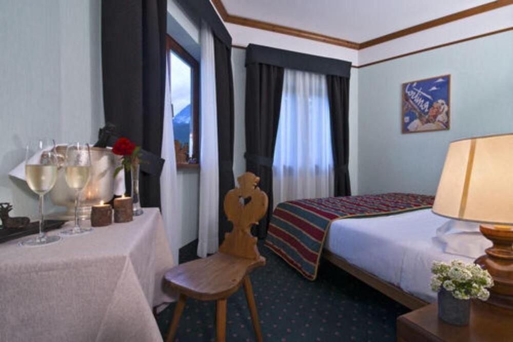 Foto de una habitación de Boutique Hotel Villa Blu Cortina D&amp;#039;Ampezzo