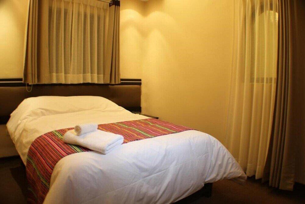 Foto de una habitación de Tampu Hotel