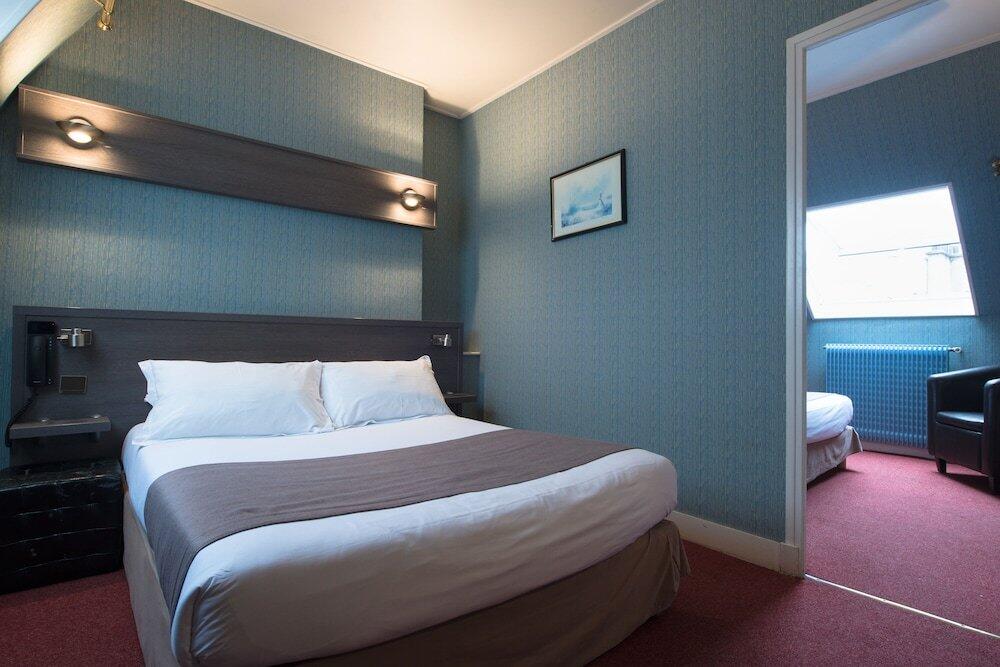 Foto de una habitación de Hotel Home Latin