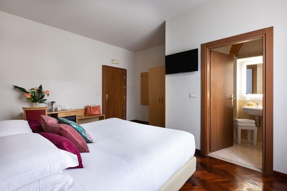 Foto de una habitación de Aramis Rooms