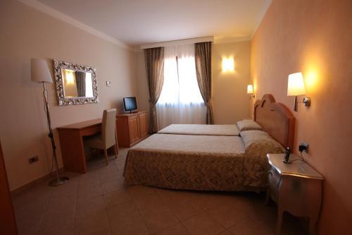 Foto de una habitación de Hotel La Perla