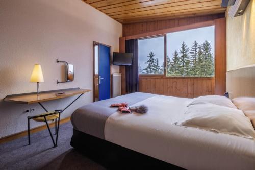 Foto de una habitación de Belambra Clubs Arc 1800 - Hôtel Du Golf