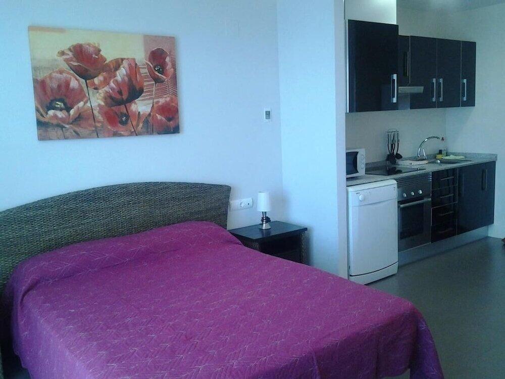 Foto de una habitación de Aparthotel El Faro
