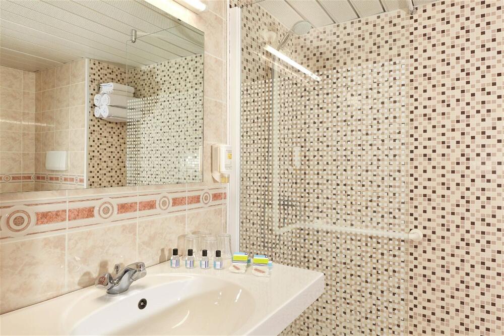 Foto del baño de Hôtel Roissy