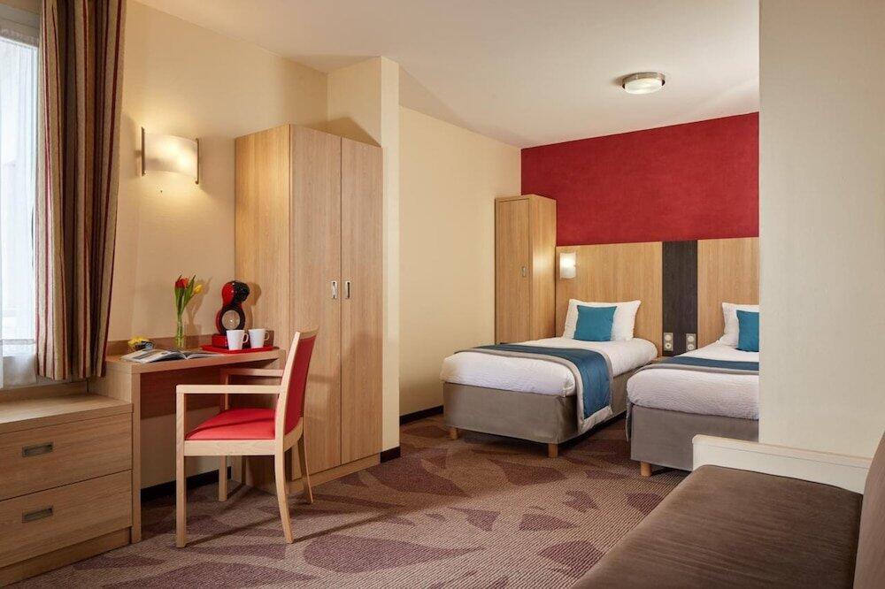 Foto de una habitación de Hôtel Roissy