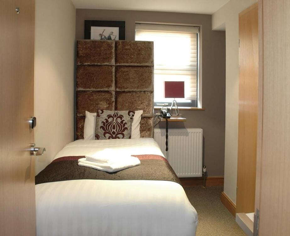 Foto de una habitación de Homestay Hotel