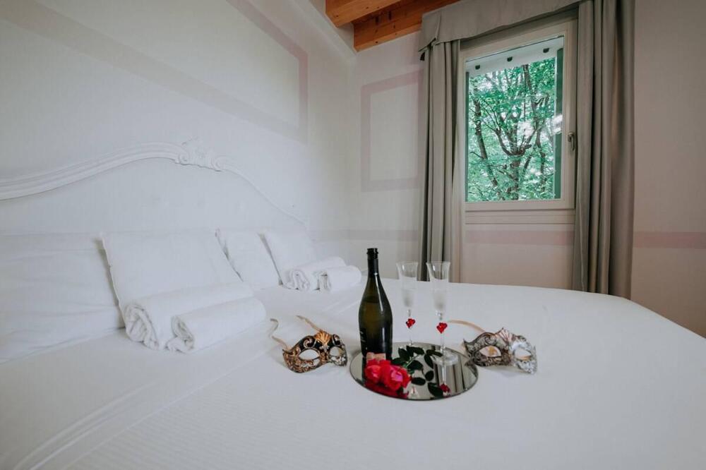 Foto de una habitación de Hotel Villa Patriarca