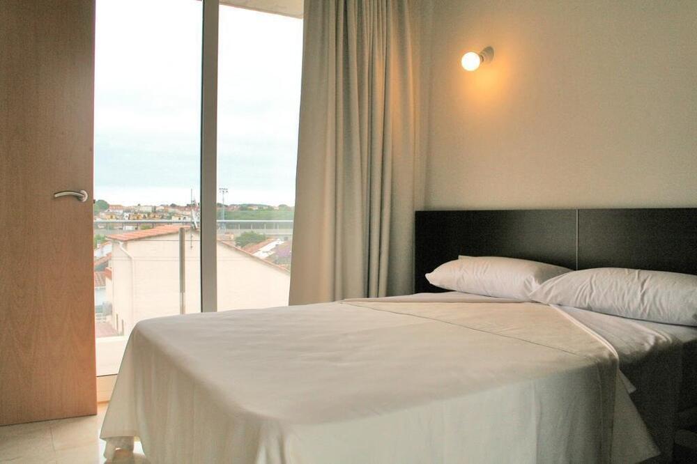 Foto de una habitación de Aparthotel L&amp;#039; Escala Resort