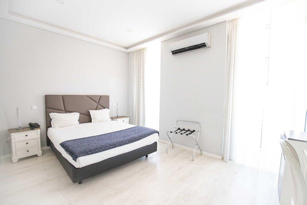 Foto de una habitación de Grande Pensão Alcobia