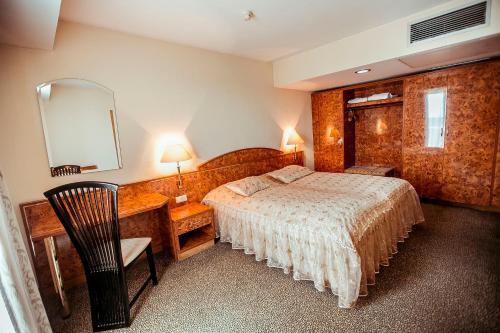 Foto de una habitación de Hotel Shodlik Palace