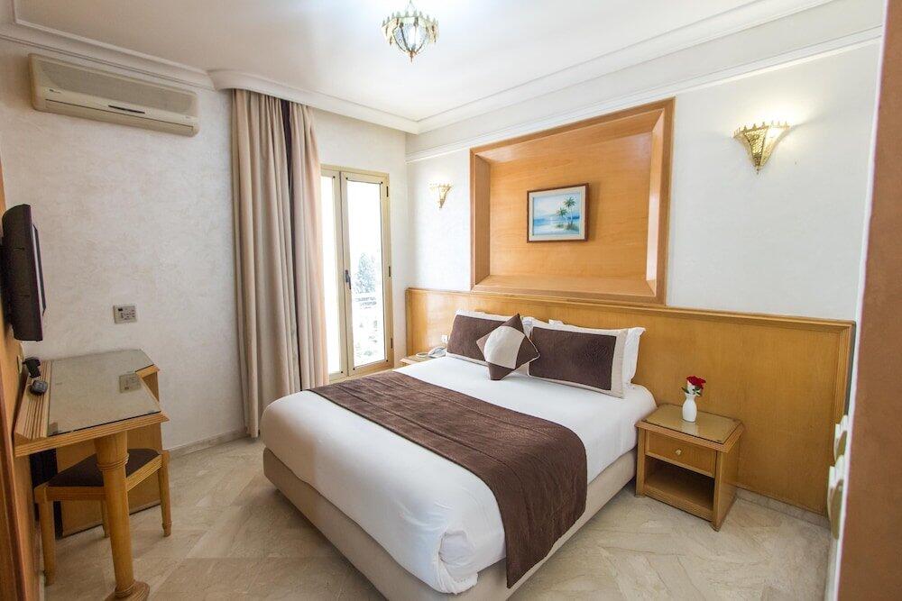 Foto de una habitación de Hotel Zahrat Al Jabal