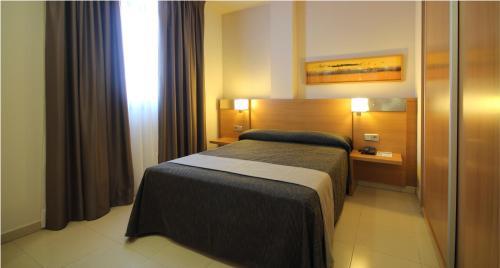 Foto de una habitación de AQUA Hotel Nostre Mar Apartments