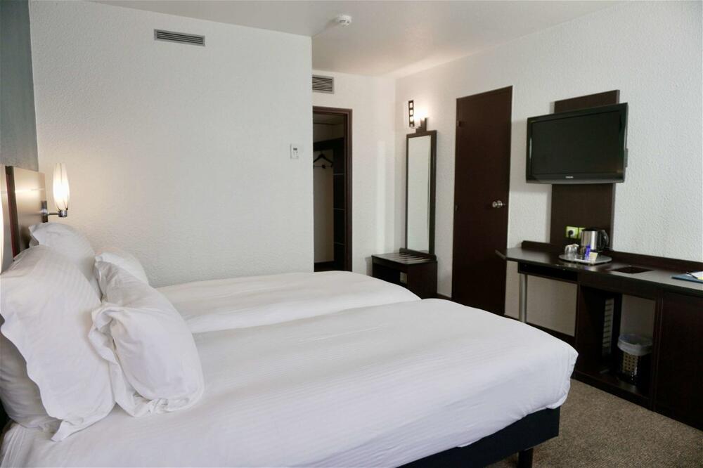 Foto de una habitación de Hotel Golden Tulip Roissy Saint Witz