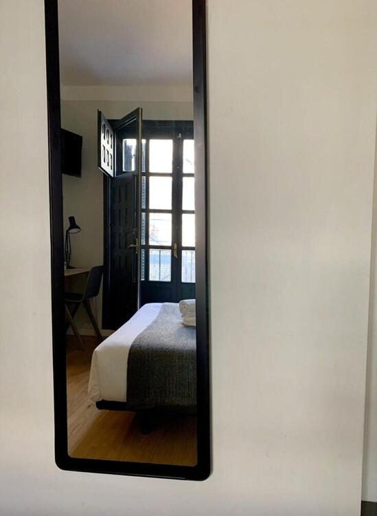 Foto de una habitación de Complutum Hostel