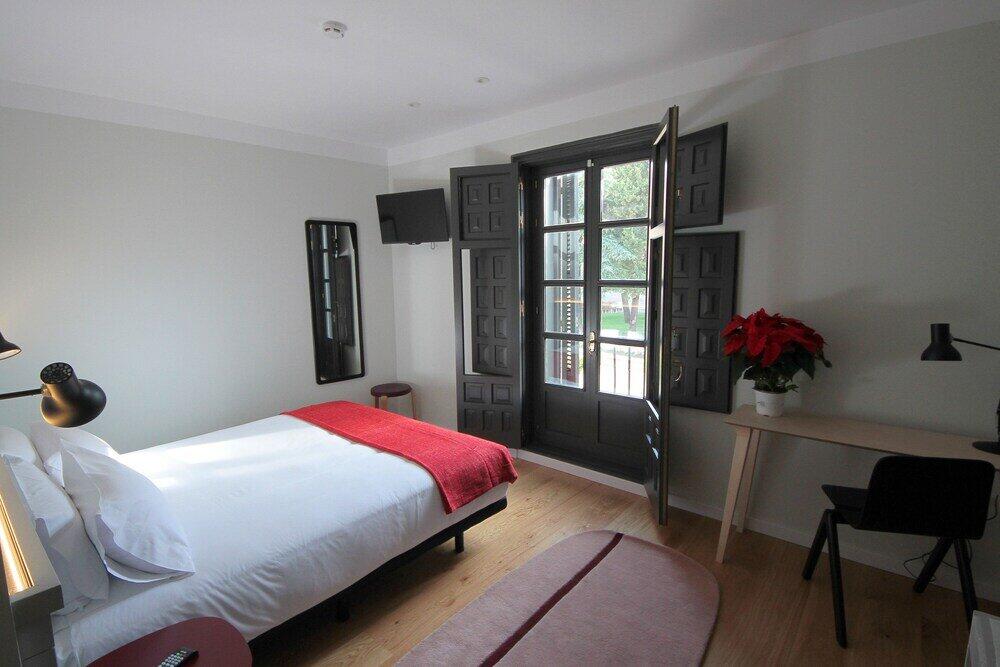 Foto de una habitación de Complutum Hostel