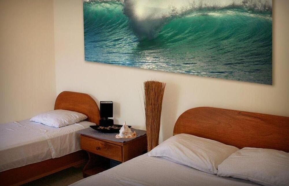 Foto de una habitación de Blue Palm Hotel